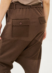 Reverse cut baggy pants with brown belt