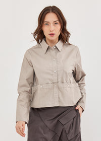 A button-down shirt is getting ready for a gray short - 00