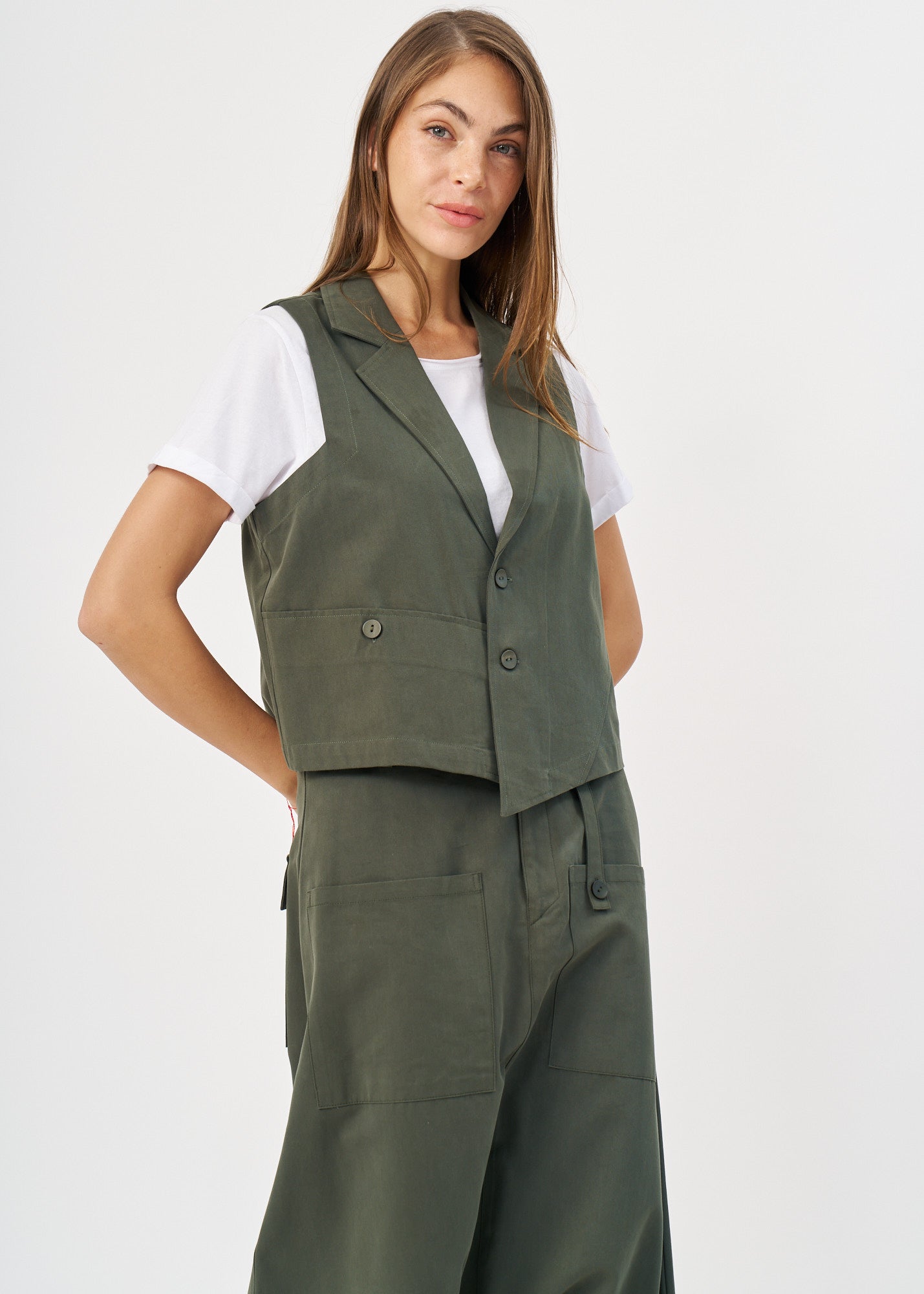 Dark green asymmetrical extension vest