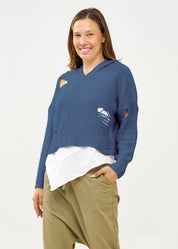 Knitwear with a blue braid extension cap