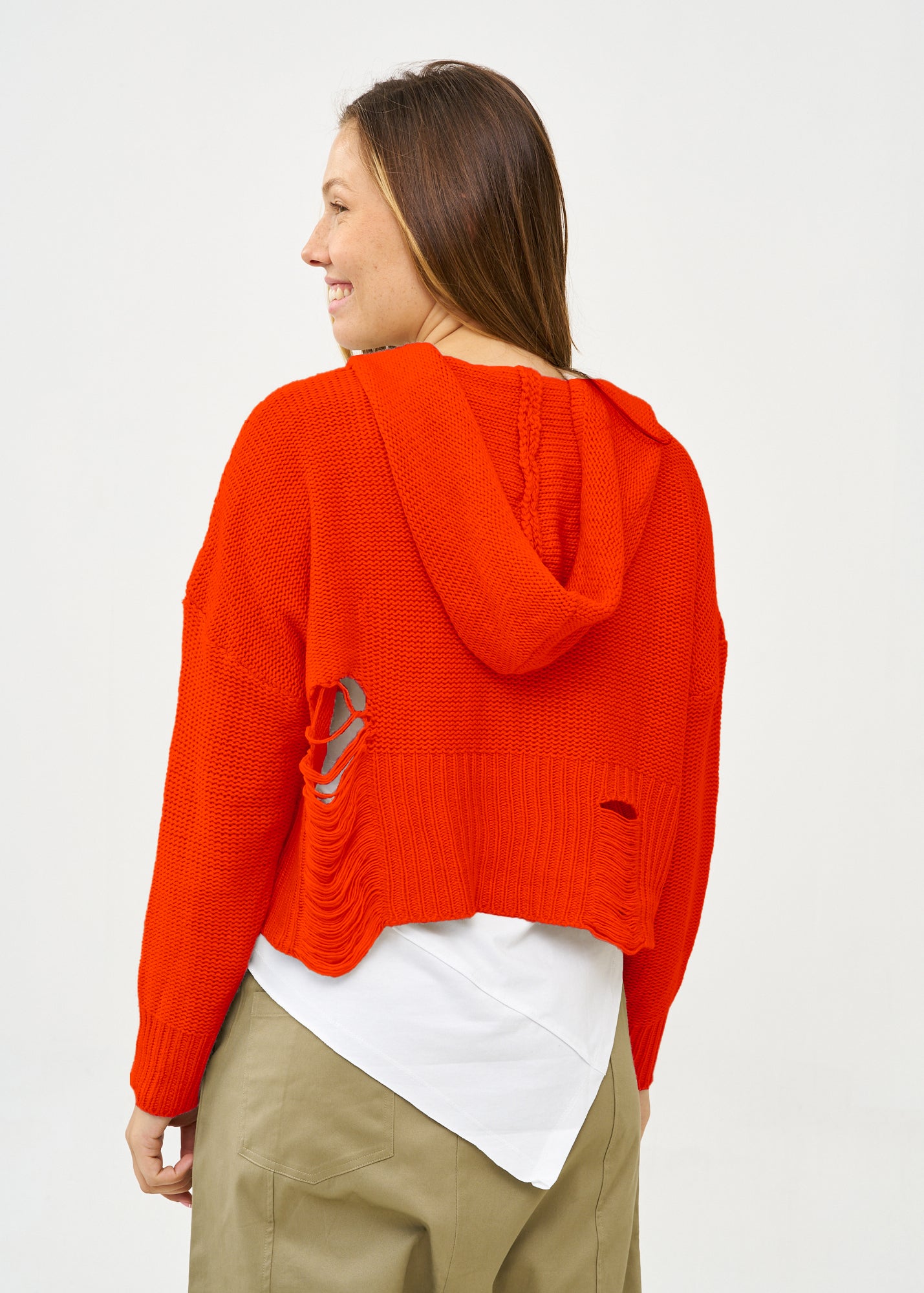 Knitwear with orange braid extension cap