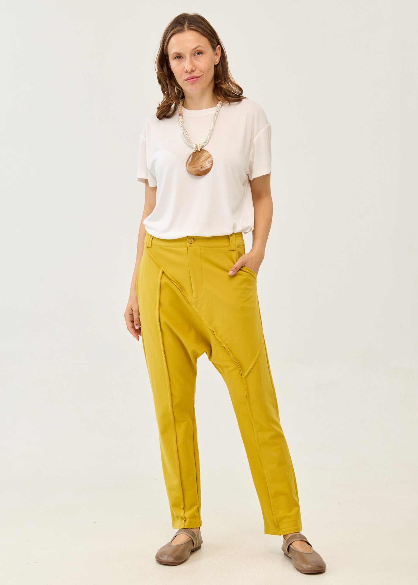 Pants with cutouts, button, and mustard zipper