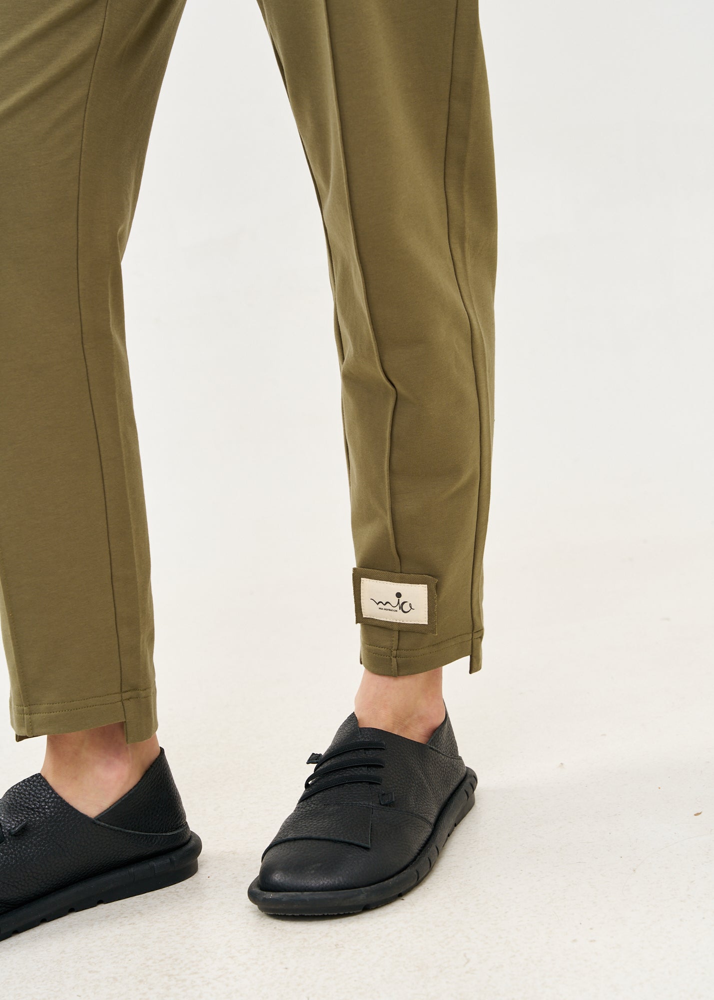 Pants seam in the middle and a dark green patch