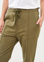 Pants seam in the middle and a dark green patch