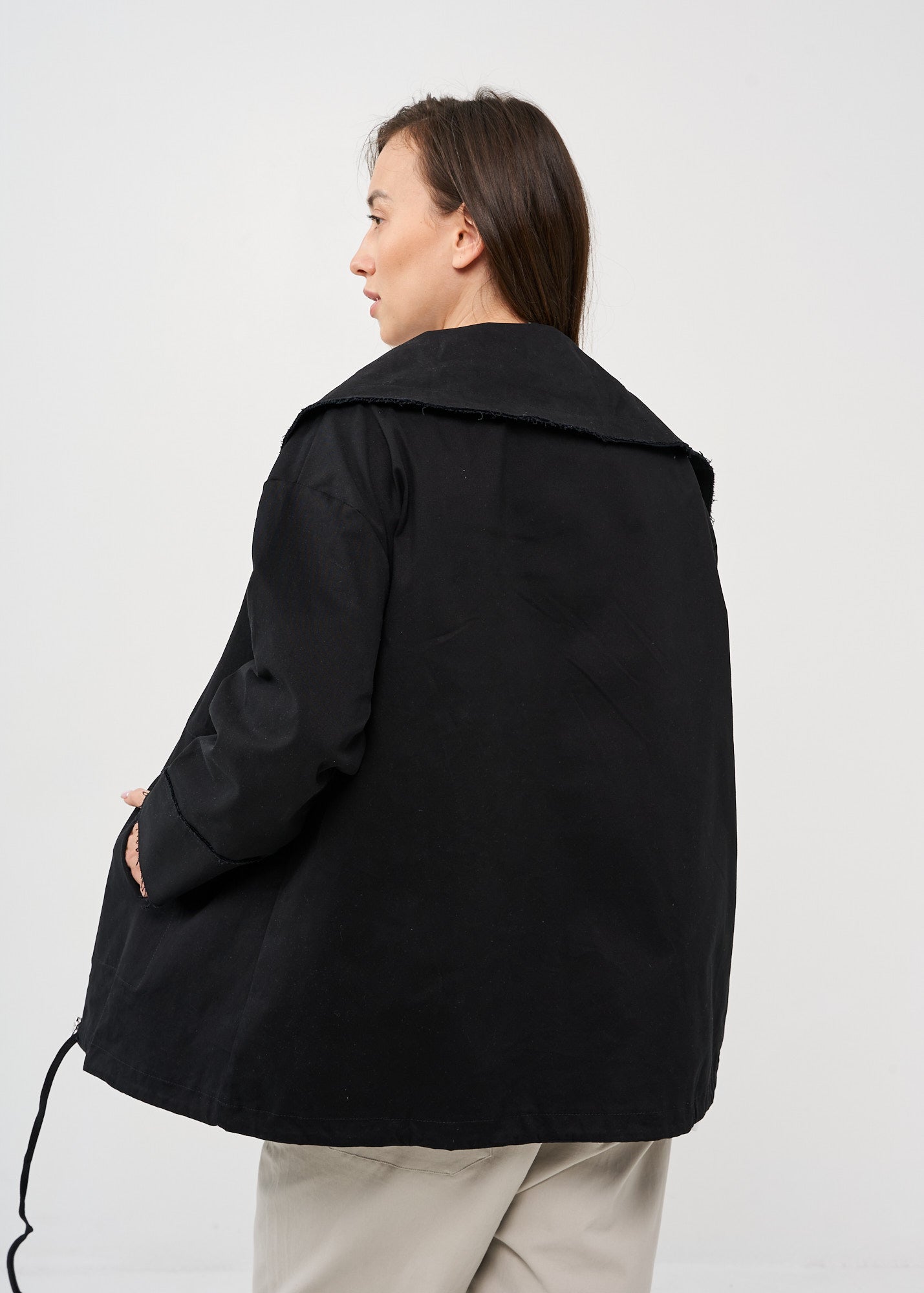 Black zipped jacket with cut-out pockets