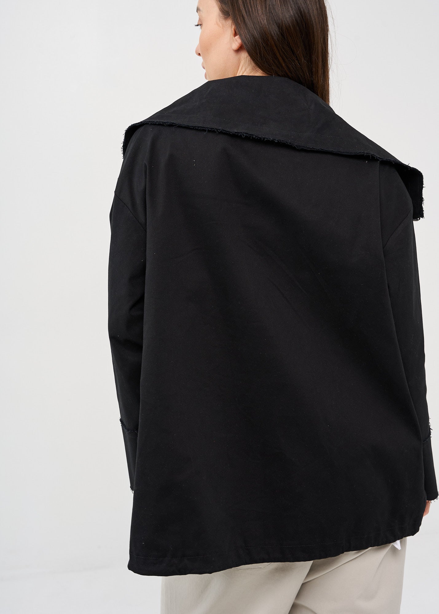 Black zipped jacket with cut-out pockets