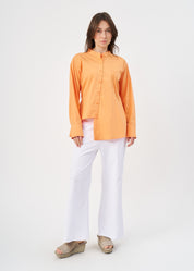 Orange button-down shirt with ribbon on the back