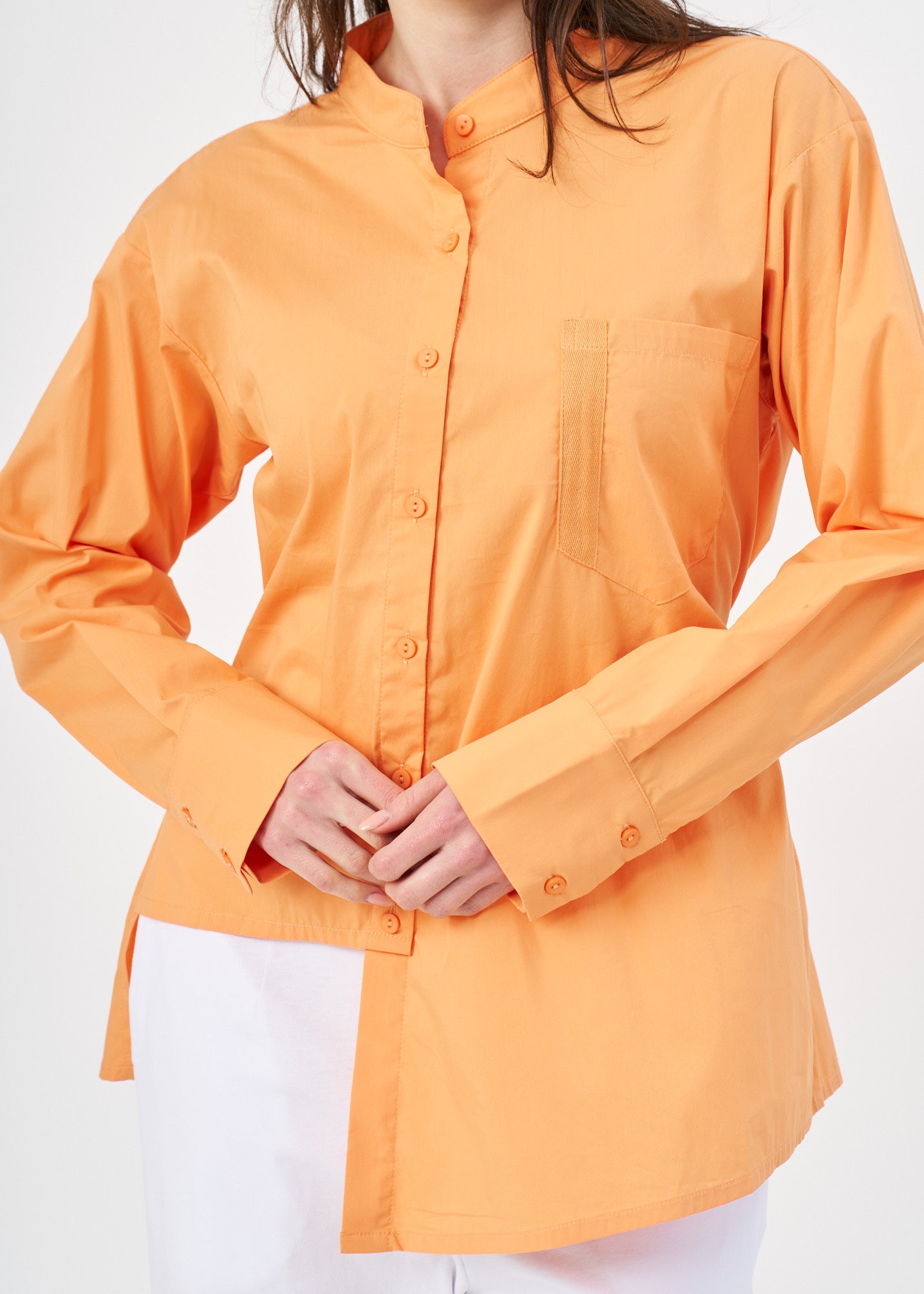 Orange button-down shirt with ribbon on the back