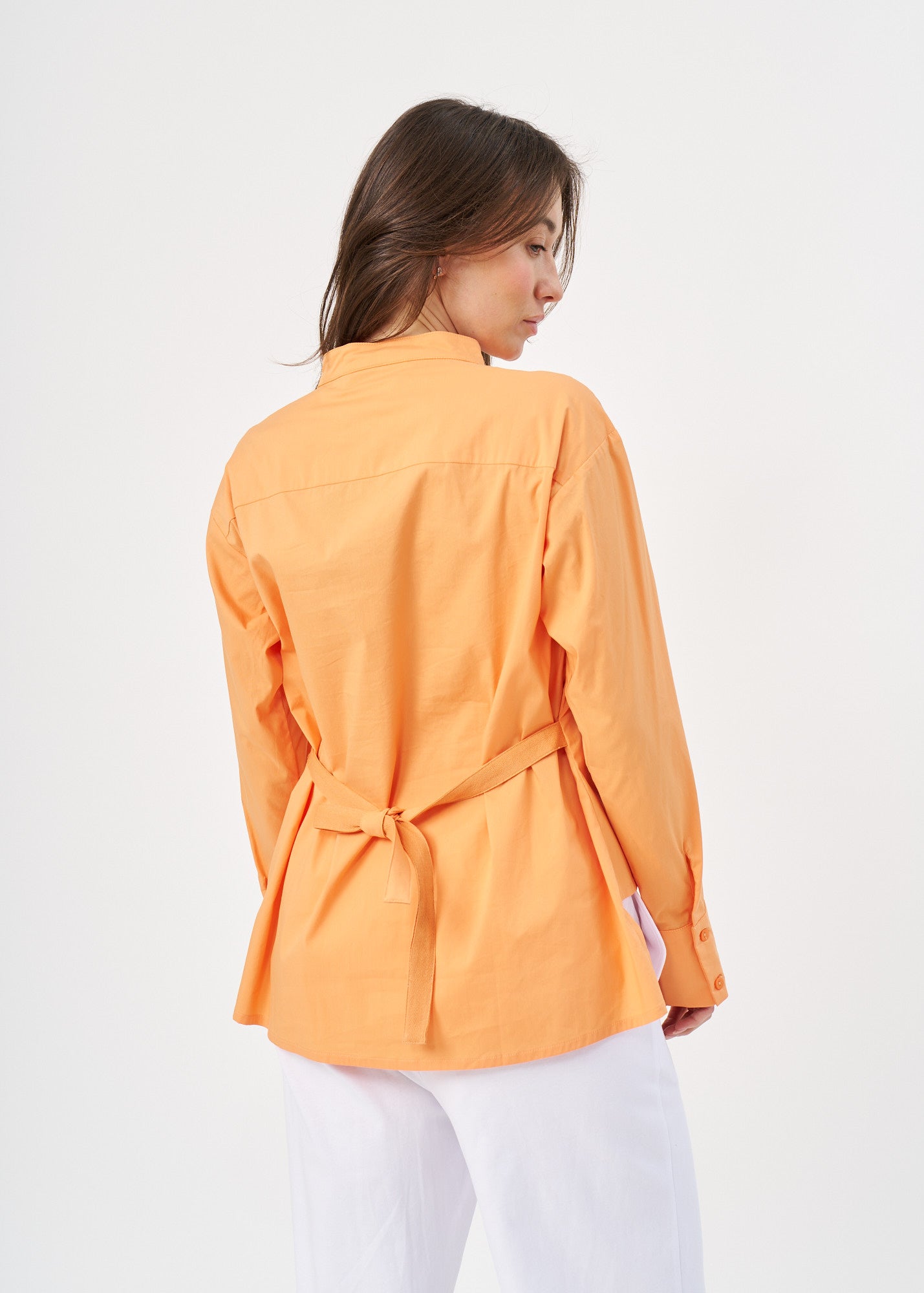 Orange button-down shirt with ribbon on the back