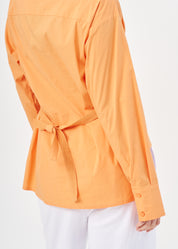 Orange button-down shirt with ribbon on the back