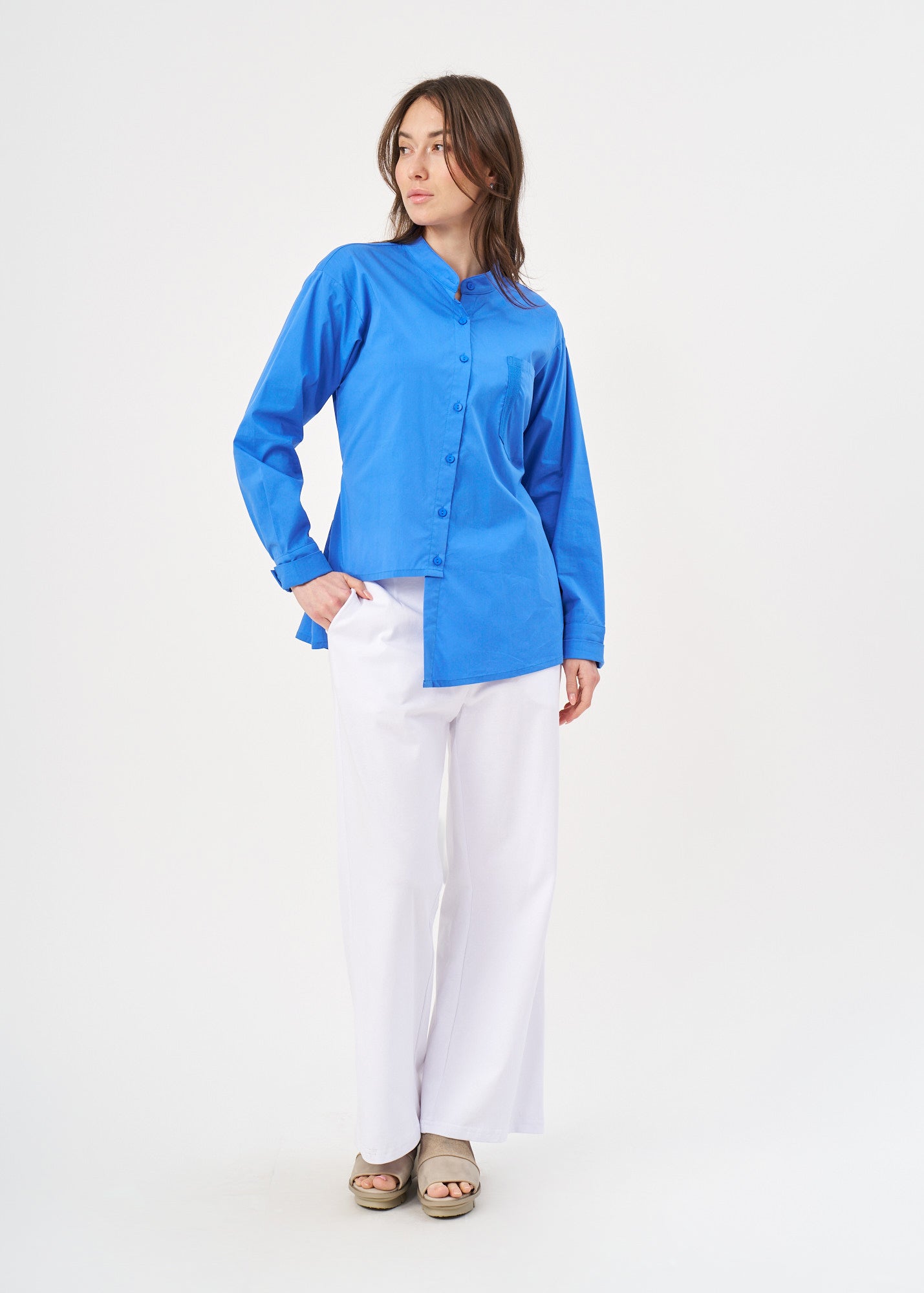 Blue button-down shirt with ribbon on the back