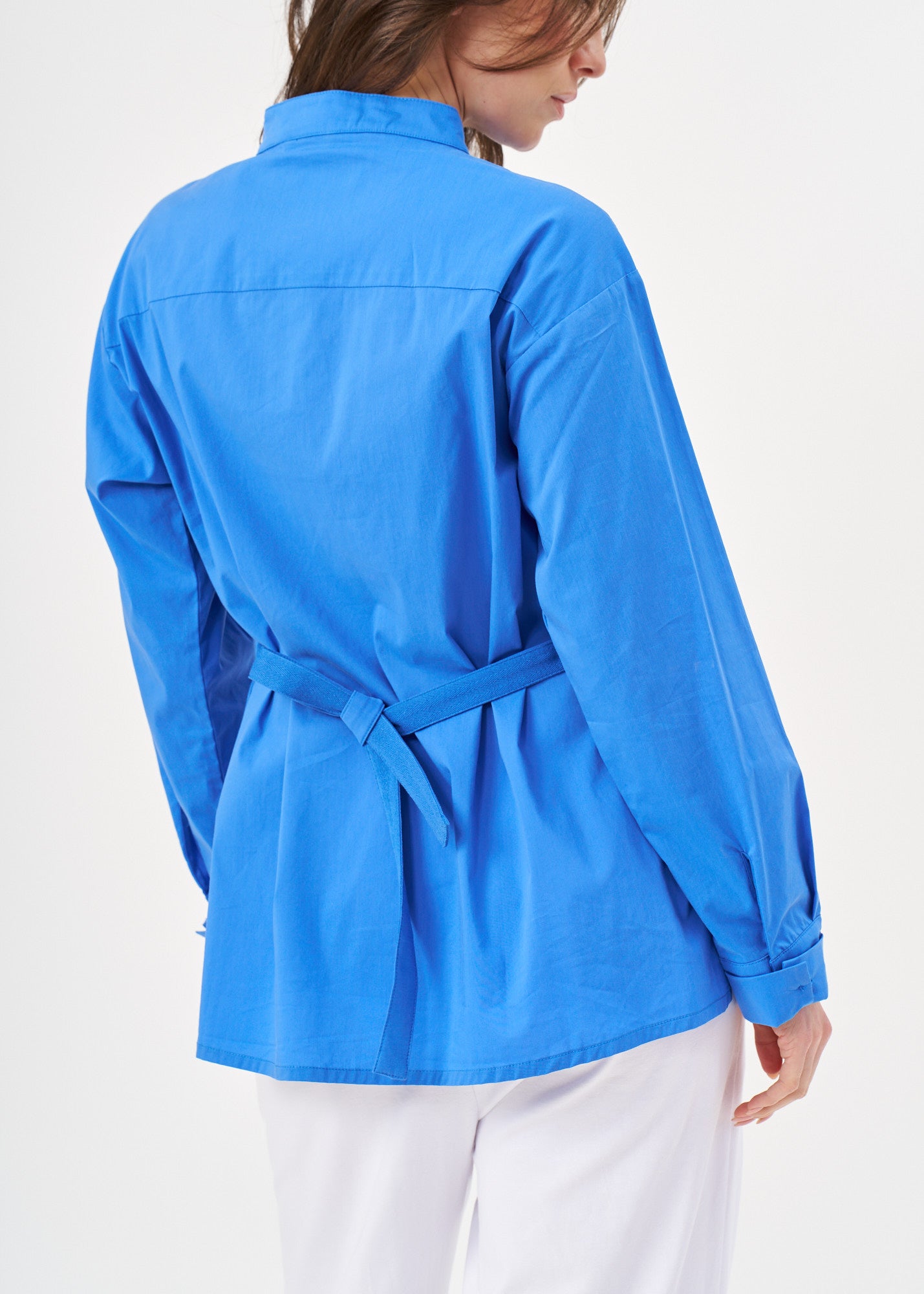 Blue button-down shirt with ribbon on the back