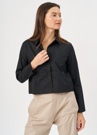 A button-down shirt is getting ready for a black short - 02