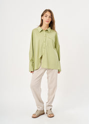 Green button-down shirt with diagonal hem and pocket