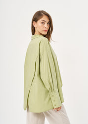 Green button-down shirt with diagonal hem and pocket