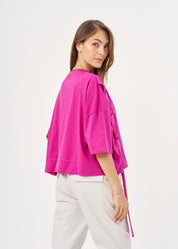 Short sleeve shirt with purple side ribbon