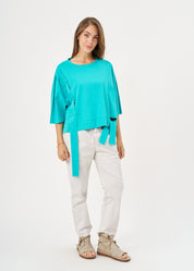 Short sleeve shirt with turquoise side ribbon