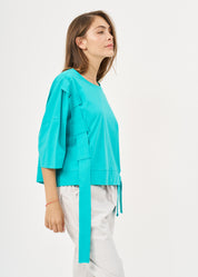 Short sleeve shirt with turquoise side ribbon