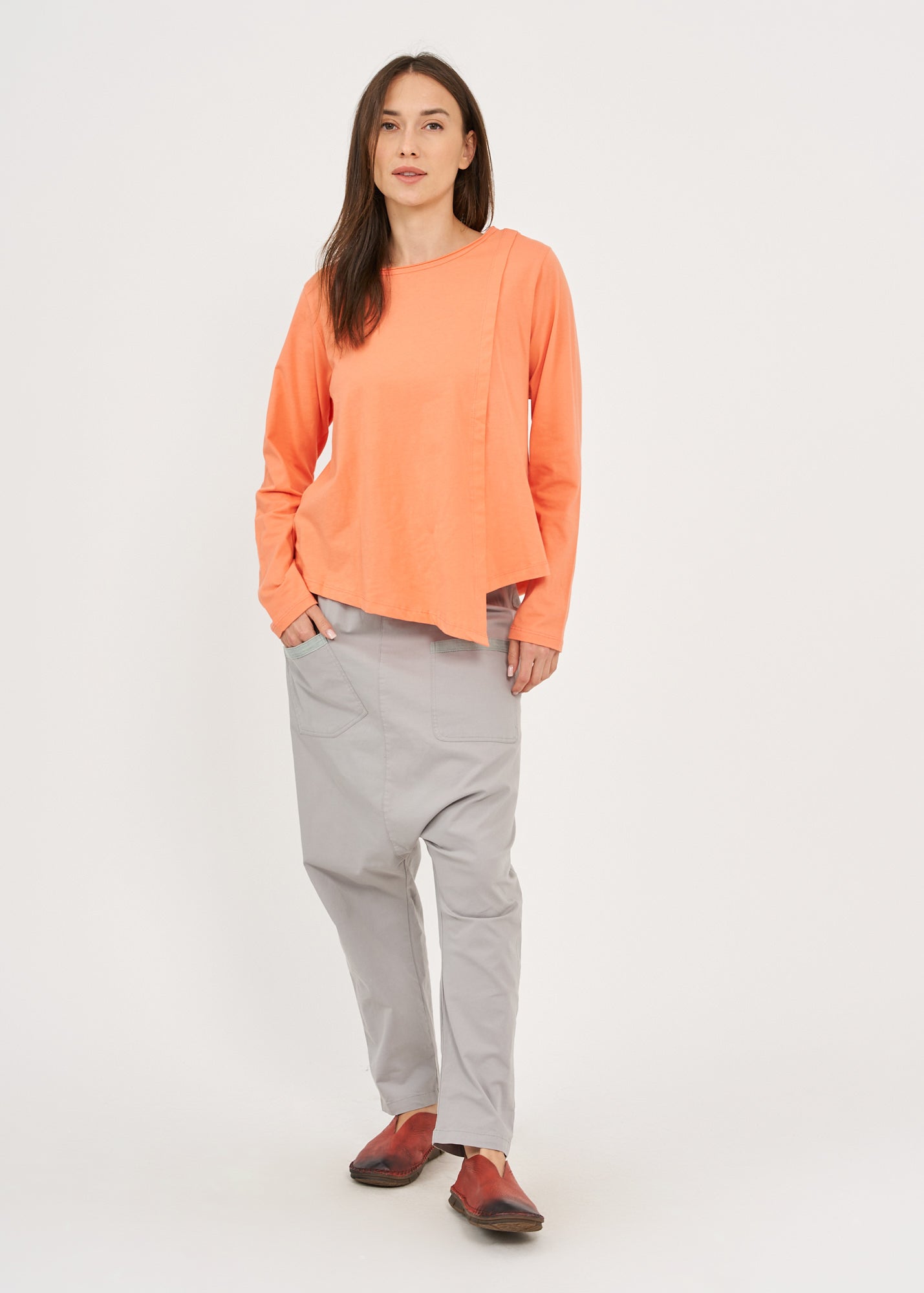 Orange long-sleeved asymmetrical pleated shirt