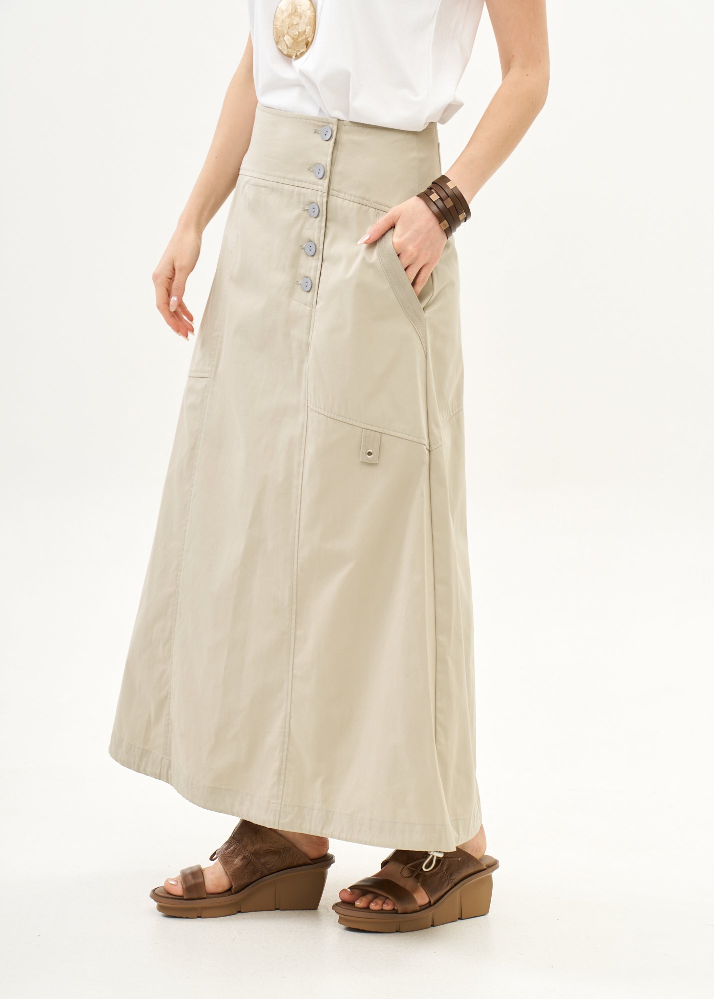 Button closure skirt with stone ribbon combination
