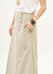 Button closure skirt with stone ribbon combination