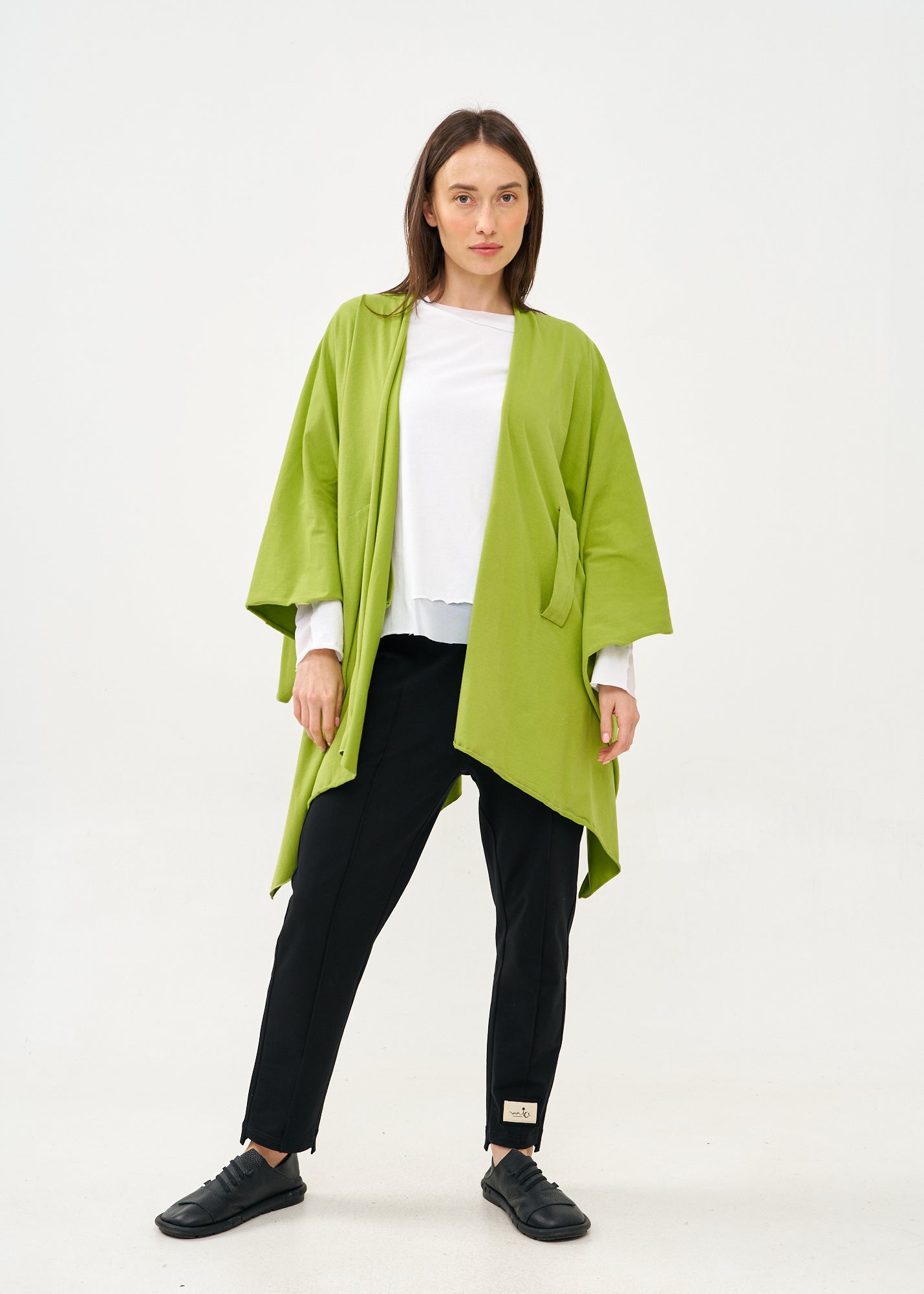 Green cape with diagonal closure