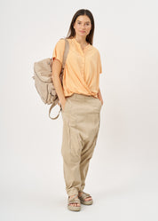 Shirt with buttons and a twisted orange extension
