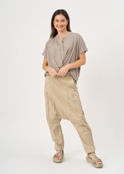 Shirt with buttons and a twisted extension, gray