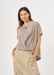 Shirt with buttons and a twisted extension, gray