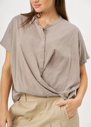 Shirt with buttons and a twisted extension, gray