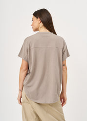 Shirt with buttons and a twisted extension, gray