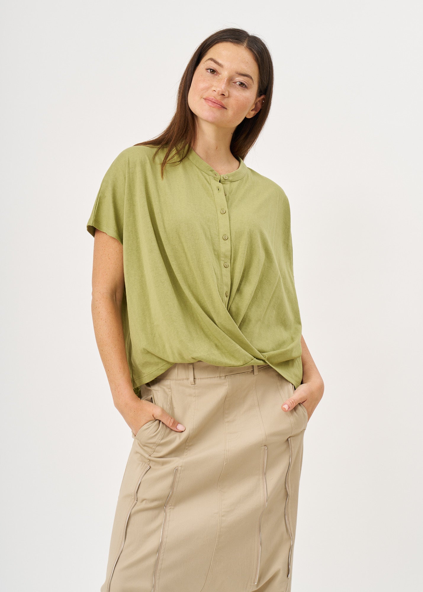 Green button-down shirt with a twisted hem