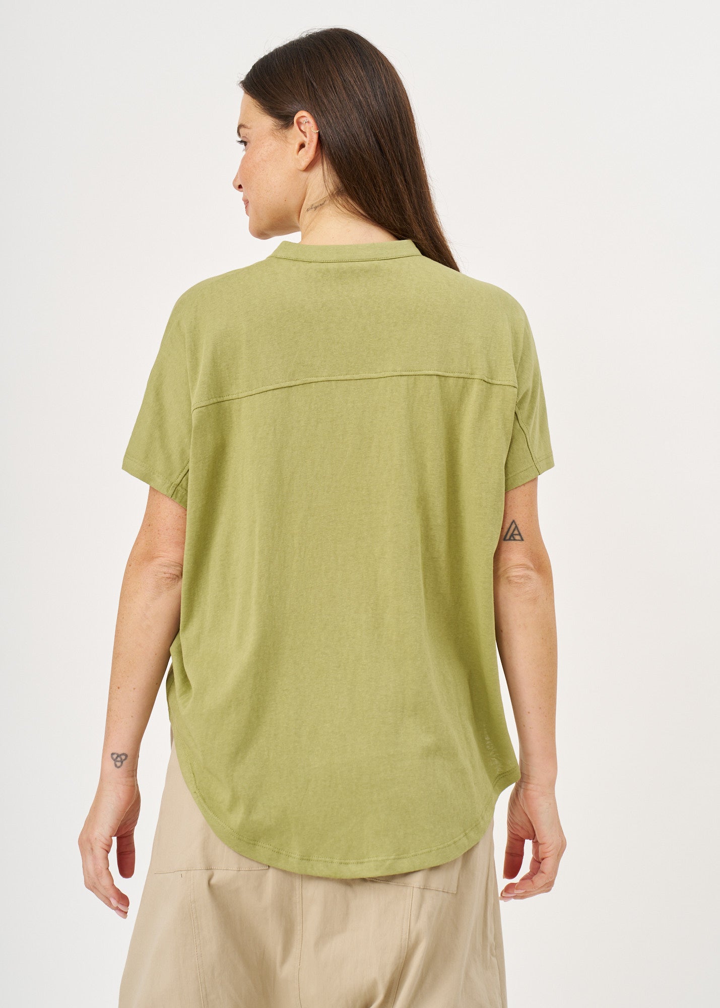 Green button-down shirt with a twisted hem