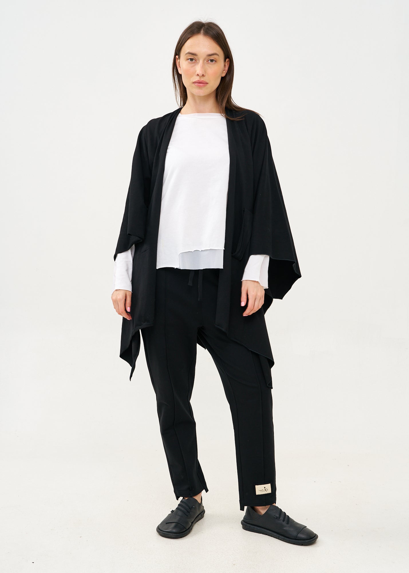 Black cape with diagonal closure