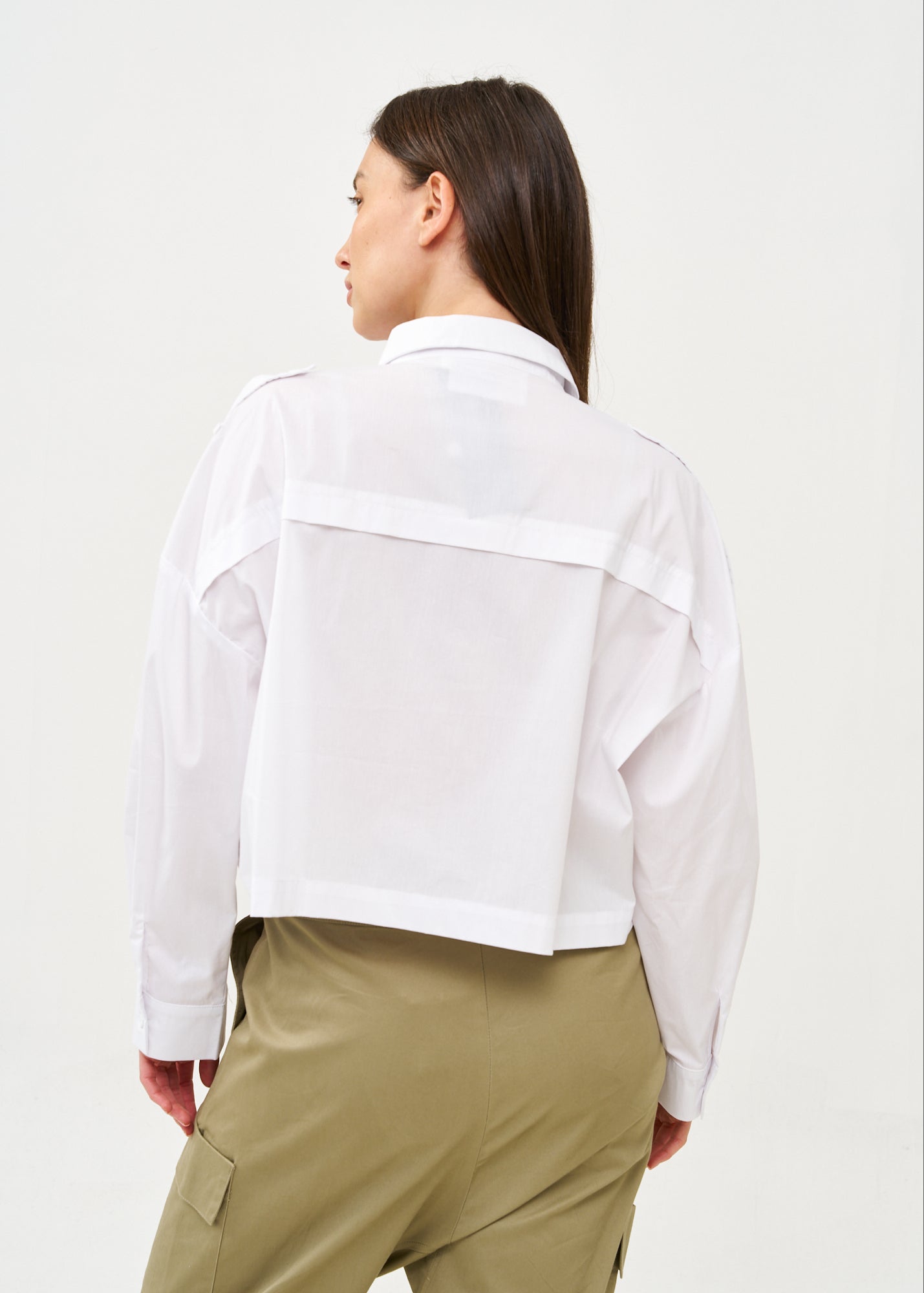 White button-down shirt with long shoulder straps