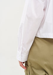 White button-down shirt with long shoulder straps