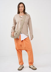 Long sleeve shirt with three buttons and brown ribbon