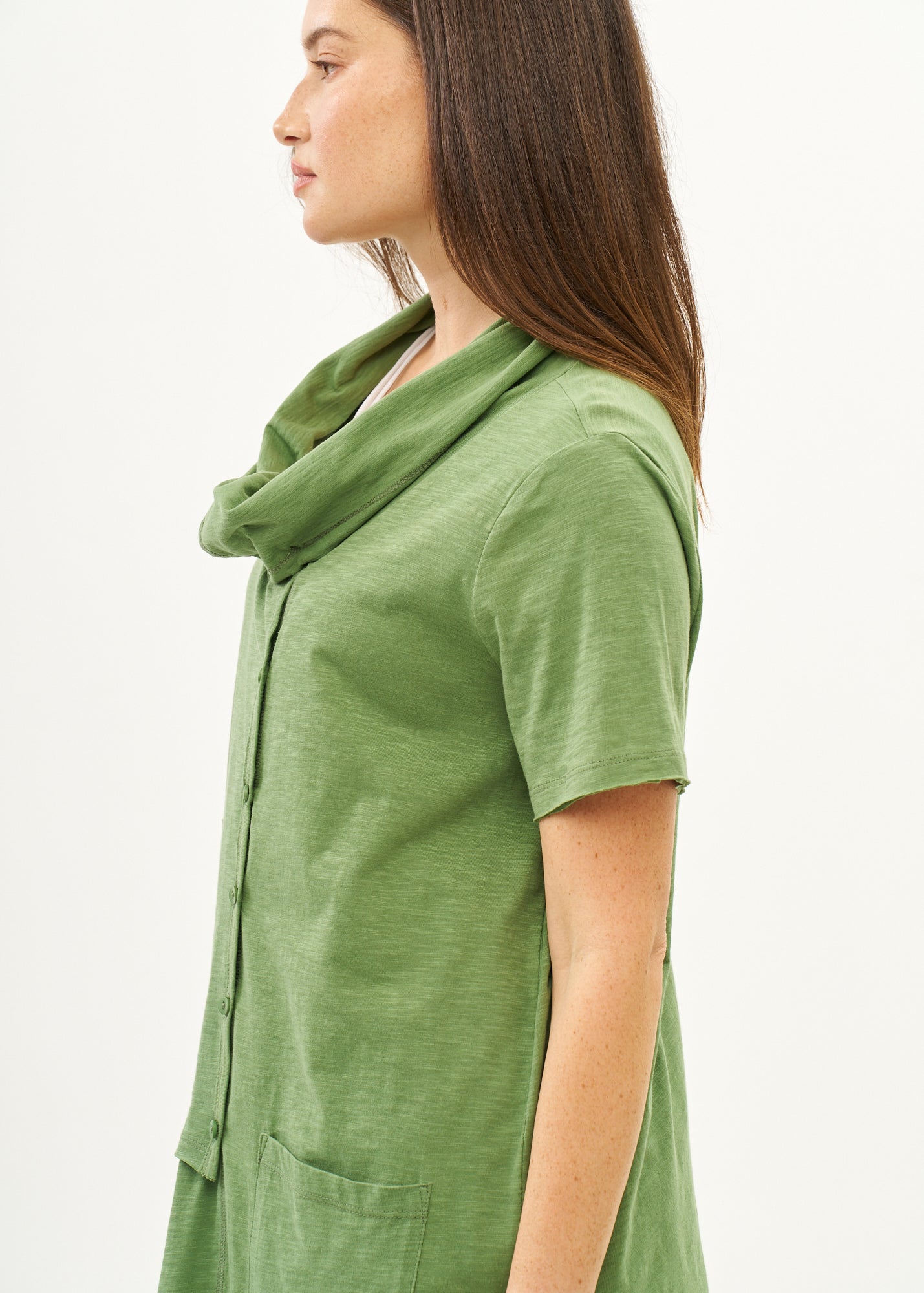 Green short-sleeved collared and buttoned top