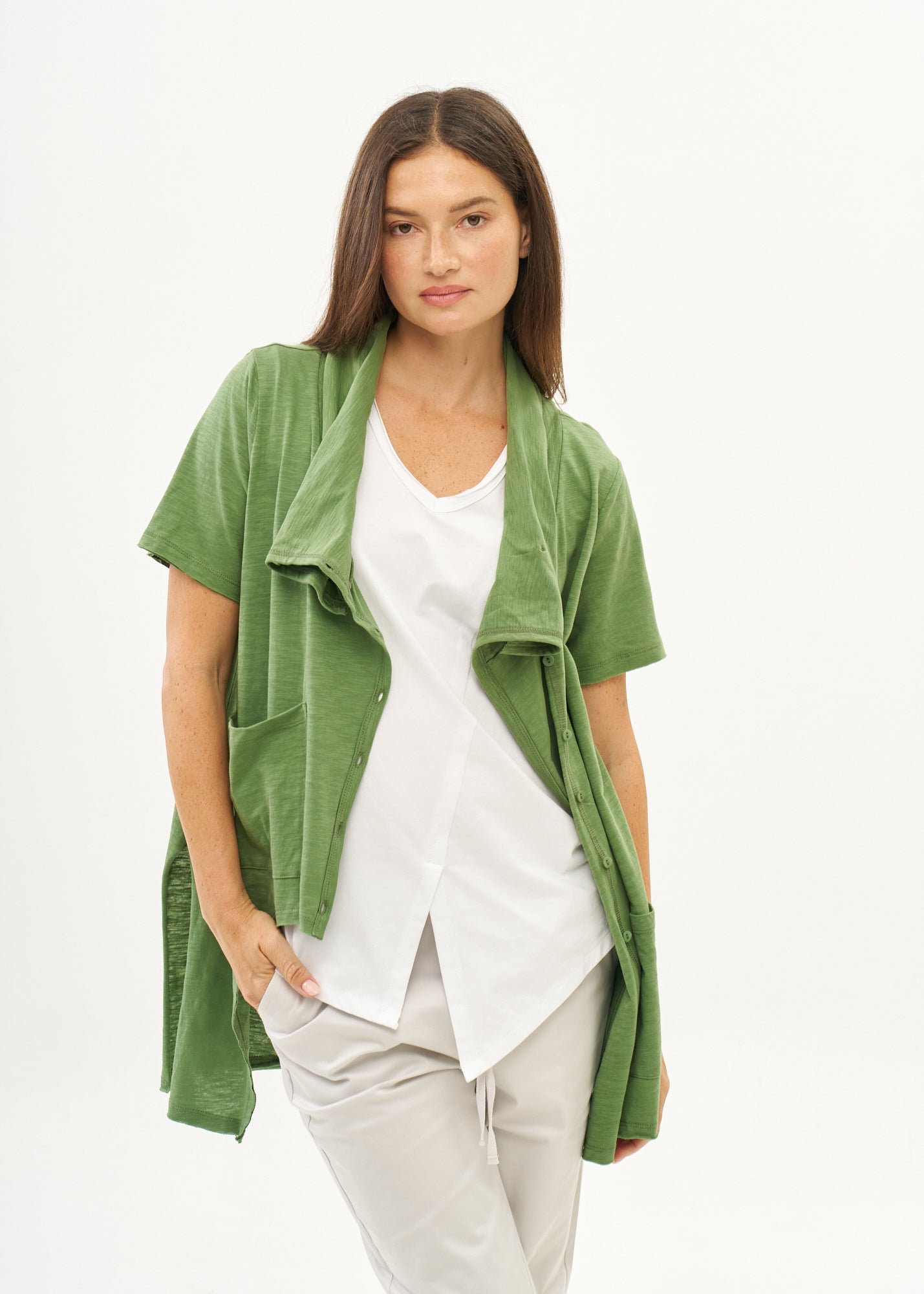 Green short-sleeved collared and buttoned top