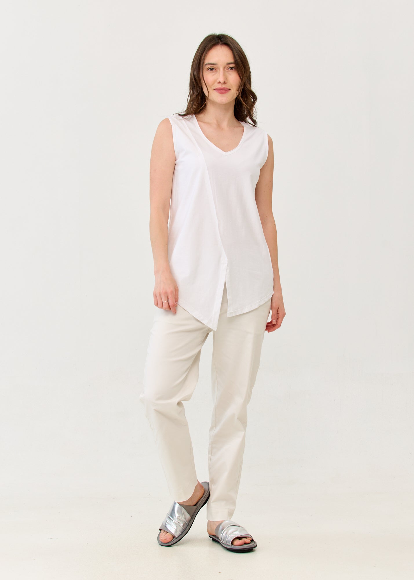 White V-neck tank top with diagonal stitching and slits