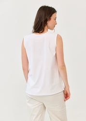 White V-neck tank top with diagonal stitching and slits