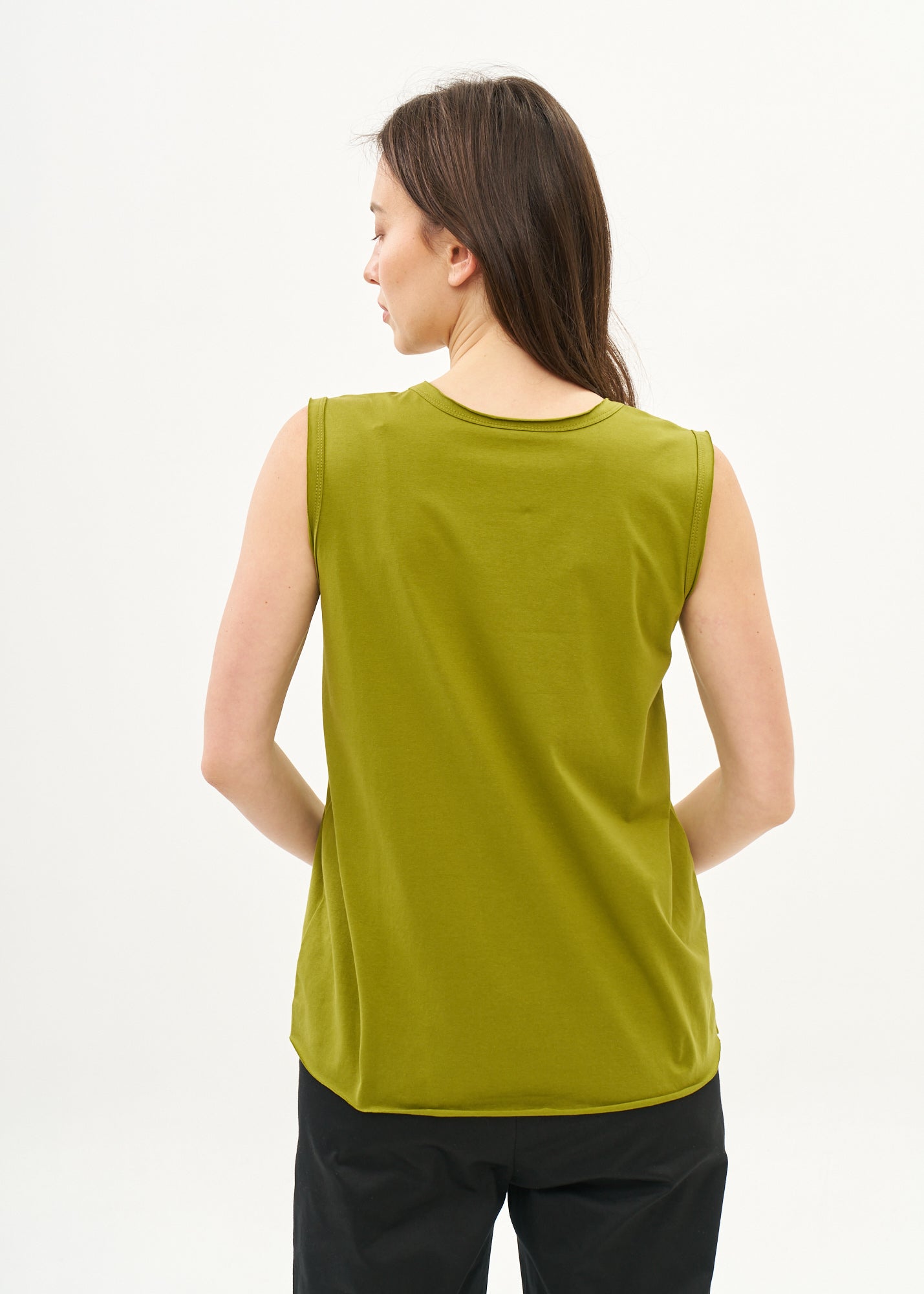 Green V-neck tank top with diagonal stitching and slits
