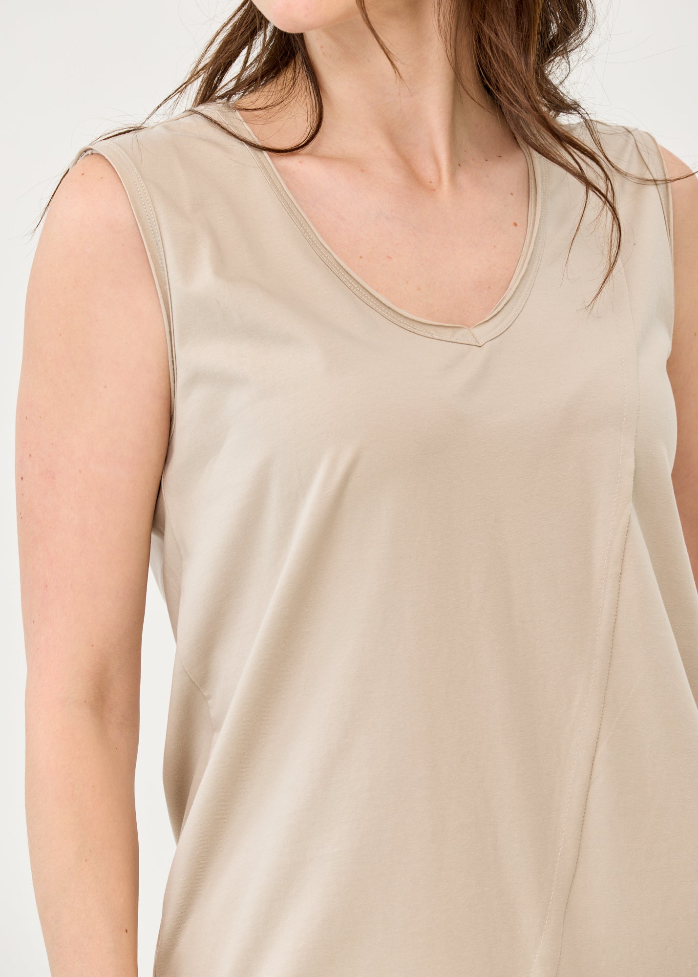 V-neck tank top with diagonal stitching and stone accents
