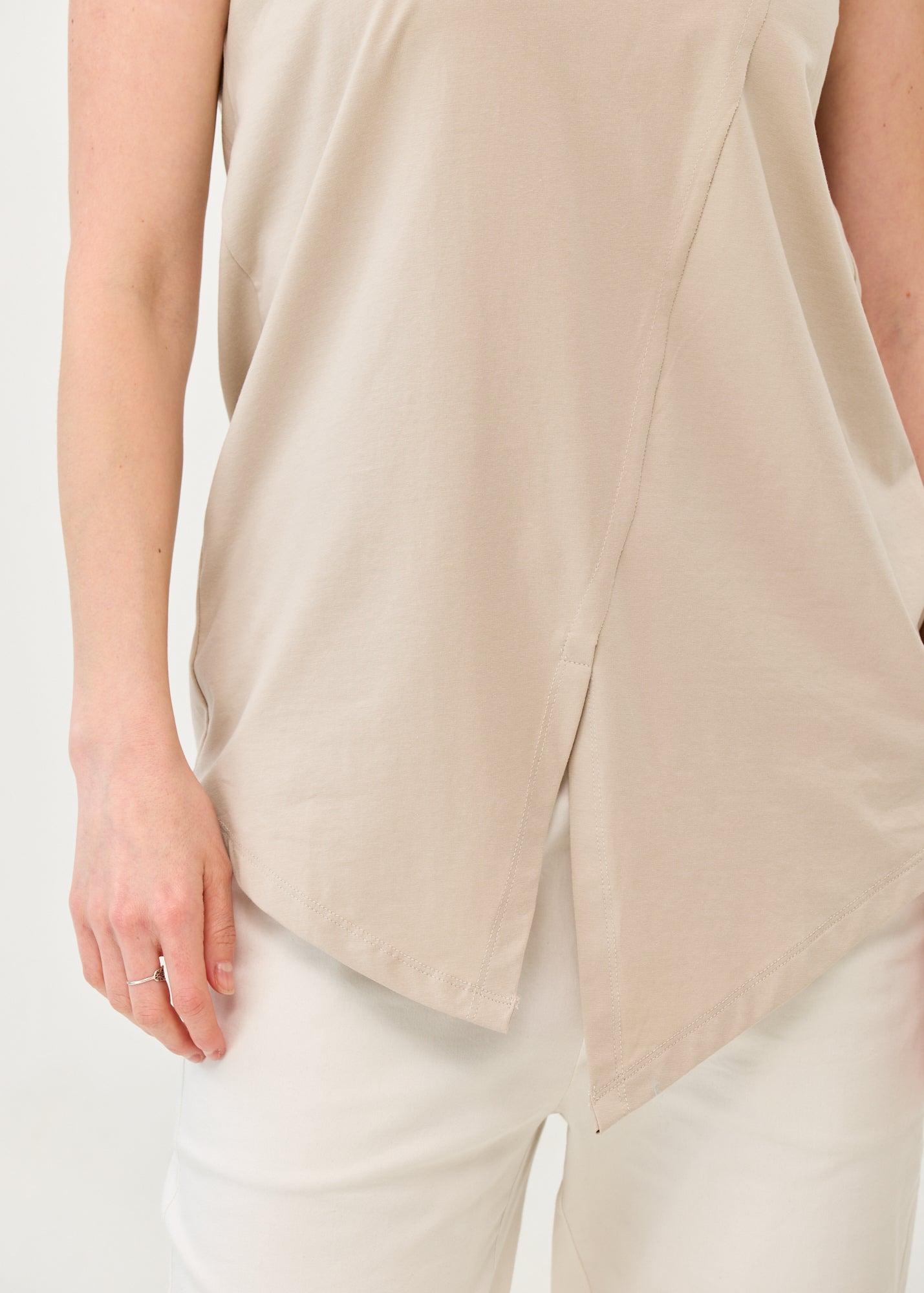 V-neck tank top with diagonal stitching and stone accents