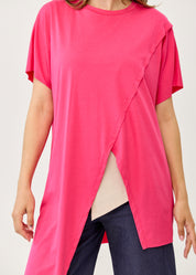 Fuchsia pink short-sleeve tunic with an asymmetrical cut