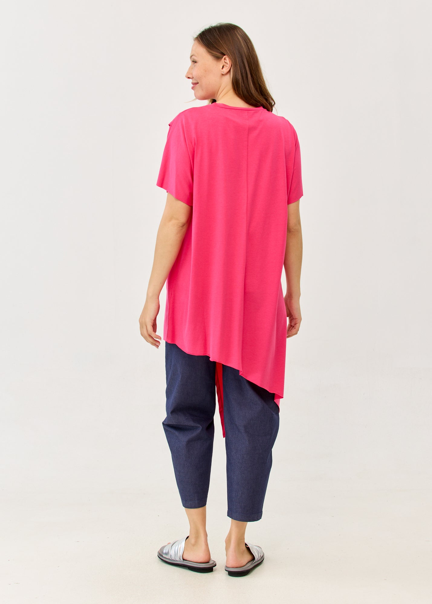 Fuchsia pink short-sleeve tunic with an asymmetrical cut