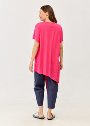 Fuchsia pink short-sleeve tunic with an asymmetrical cut