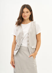 Vest with diagonal pockets and tie-back in grey