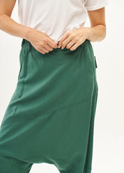 Green trousers with pleats, color combination, fold at the hem