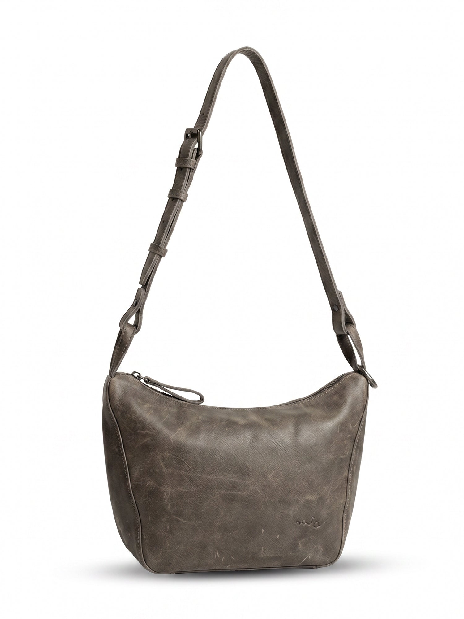 Leather evening bag with a thin strap and a dark brown ring